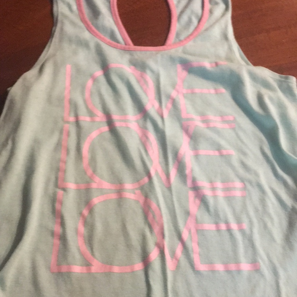 Blue and pink shirt that says love three times